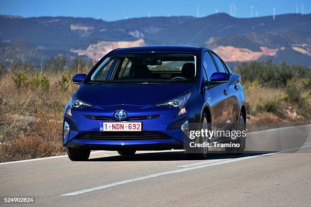 toyota prius on the road - toyota prius stock pictures, royalty-free photos & images