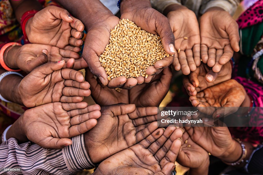 Poor Indian children asking for food, India