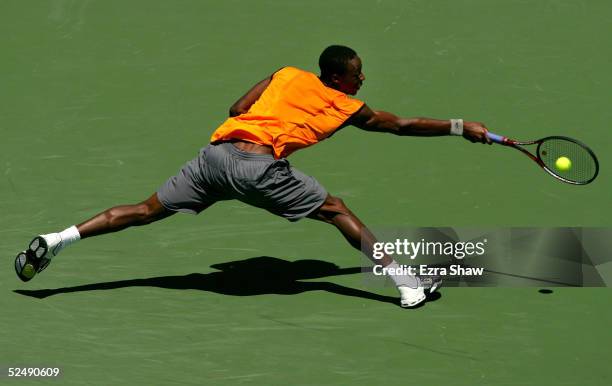 Gael Monfils of France reaches to return to Dominik Hrbaty of Slovakia during the NASDAQ-100 Open at the Crandon Park Tennis Center on March 29, 2005...