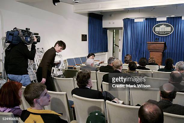 Members of the media wait for the start of the daily briefing by White House press secretary Scott McClellan in the briefing room that is located in...