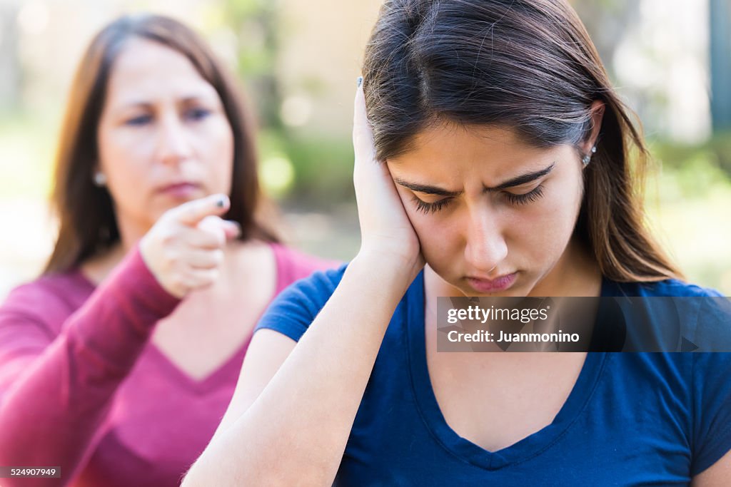 Mother scolding her daughter after giving her a slap