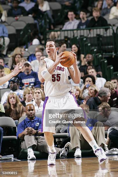 Rafael Araujo of the Toronto Raptors controls the ball against the Dallas Mavericks during the game on March 7, 2005 at the American Airlines Center...