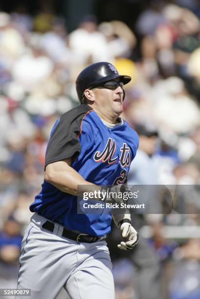 Catcher Jason Phillips of the New York Mets runs during a Spring Training game against the Atlanta Braves on March 6, 2005 at Cracker Jack Stadium at...