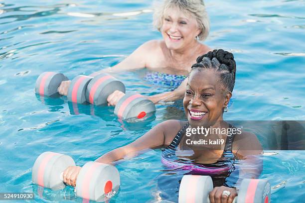 senior black woman and friend doing water aerobics - water aerobics stock pictures, royalty-free photos & images