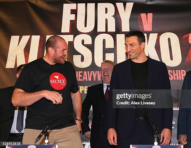 Tyson Fury dances next to Wladimir Klitschko as they go head to head during a press conference at the Manchester Arena on April 27, 2016 in...