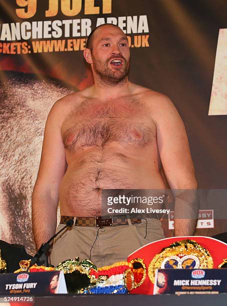 Tyson Fury faces the media bare chested during a press conference ahead of his fight with Wladimir Klitschko at the Manchester Arena on April 27,...