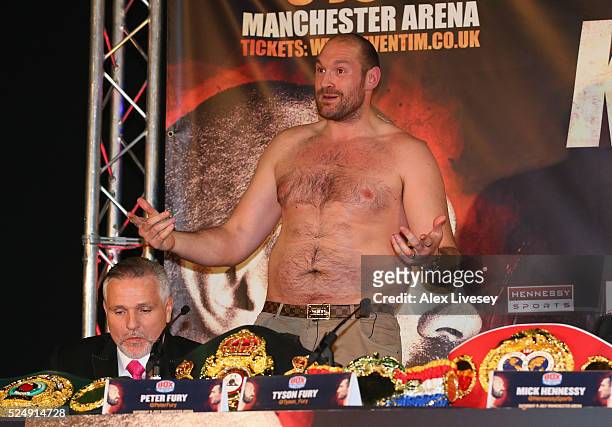 Tyson Fury faces the media bare chested during a press conference ahead of his fight with Wladimir Klitschko at the Manchester Arena on April 27,...