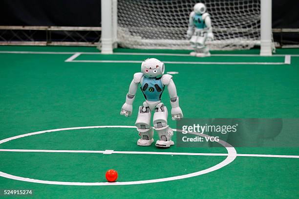 Robots compete during the 2016 RoboCup at Anhui Jianzhu University on April 26, 2016 in Hefei, Anhui Province of China. The robots beat men with the...