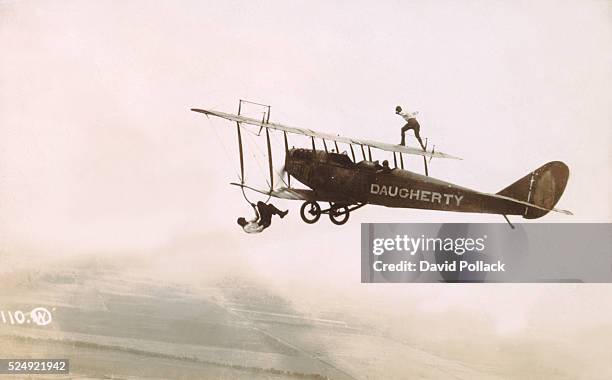 Photograph of a Wingwalkers on a Biplane