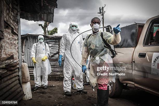 Liberian Red Cross &amp;amp;quot;burial&amp;amp;quot; team, in Monrovia, Liberia, on October 14, 2014. The worst-ever Ebola epidemic has already...