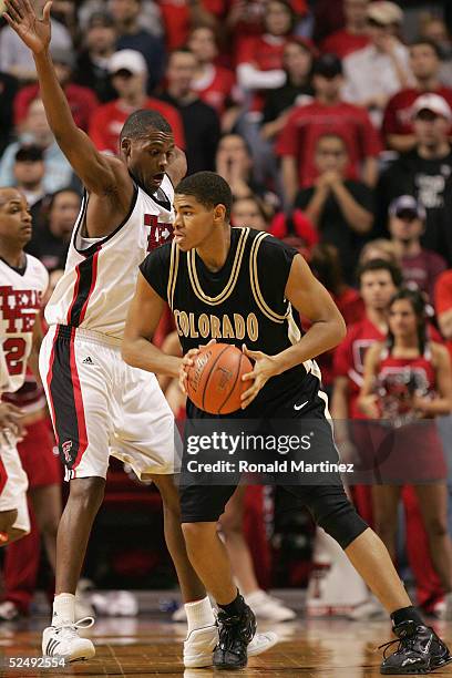 Chris Copeland of the Colorado Buffaloes looks to play the ball against Darryl Dora of the Texas Tech Red Raiders on February 2, 2005 at the United...