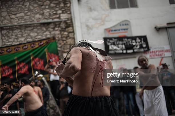 Members of the Shiite community take part in a ceremony to mark Ashura, the holiest day on the Shiite calendar, in Piraeus, Greece, Saturday 24...