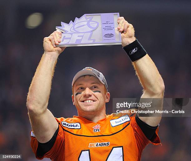 Vancouver's quarterback Travis Lulay accepts the Most Valuable Player award after leading the BC Lions to victory 34-23 over the Winnipeg Blue...