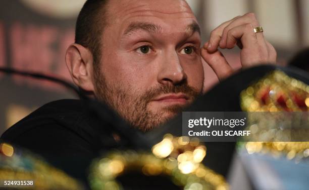 British heavyweight boxer Tyson Fury pauses during a press conference to publicise his forthcoming world heavyweight title fight against Ukranian...