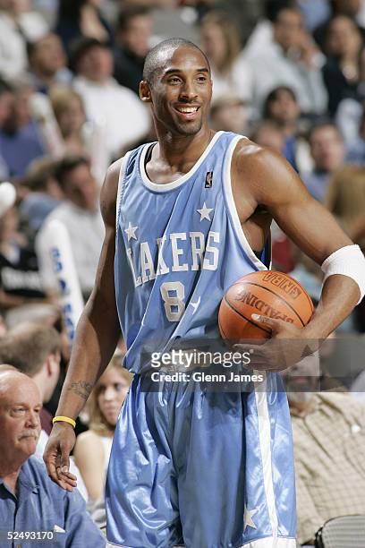 Kobe Bryant of the Los Angeles Lakers sheds a smile during the game against the Dallas Mavericks at American Airlines Arena on March 10, 2005 in...