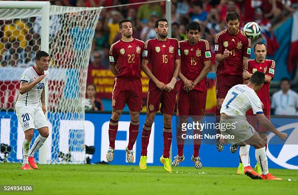 June: Alexis Sanchez shoot in the match between Spain and Chile in the group stage of the 2014 World Cup, for the group B match at the Beira Rio...
