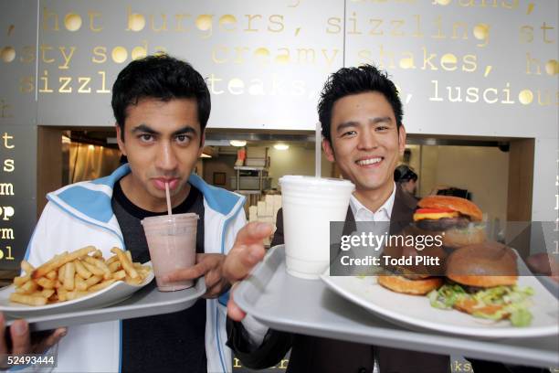 Actors Kal Penn and John Cho poses for a portrait while promoting their movie "Harold and Kumar Go To White Castle" at Pop's Burger in downtown New...