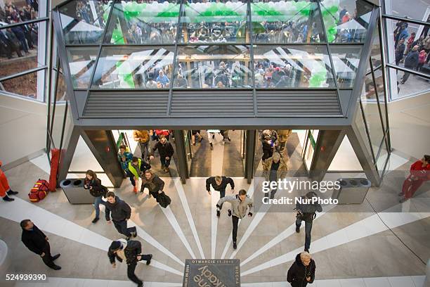 People are seen at the opening of the Zielony Arkady mall on Friday, one of Poland's largest shopping malls. The recently elected government set up a...