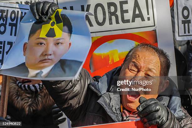 January 7, 2016 - South Korea, Seoul : South Korean protester burns defaced pictures of North Korean leader Kim Jong Un during a rally against North...