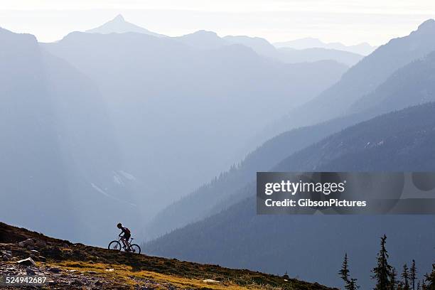 revelstoke british columbia mountain bike ride - uphill stock pictures, royalty-free photos & images