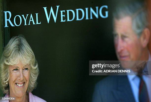 Poster celebrating the upcoming Royal Wedding hangs in the window of the local tourist office near Windsor Castle and the Guildhall 30 March 2005....