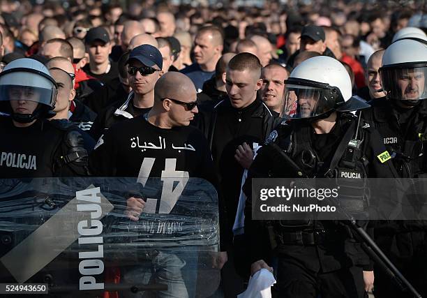 Cracovia's supporters are excorted by rieinforced security forces ahead of the derby match between Wisla Krakow and Cracovia Krakow, a Polish...