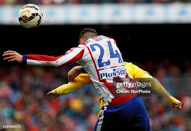Atletico de Madrid's Uruguayan Defender Jose Maria Gimenez and Getafes Spanish Defender Sergio ESCUDERO during the Spanish League 2014/15 match...