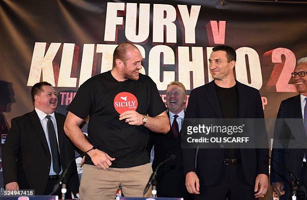 British heavyweight boxer Tyson Fury poses alongside Ukrainian heavyweight Wladimir Klitschko, during a press conference to publicise their...