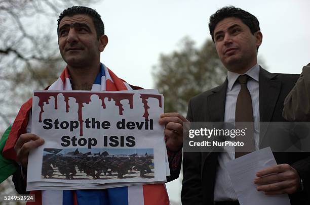 People participating in a demonstration to show solidarity with the people of Kobane, in the UK city of Manchester, as part of a global day of...