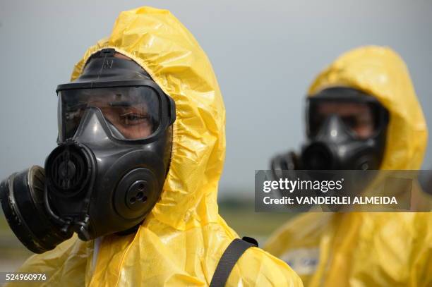 Brazilian armed forces' anti terrorist personnel in NBC protective suits participate in a drill ahead of the upcoming Rio 2016 Olympic Games, in Rio...