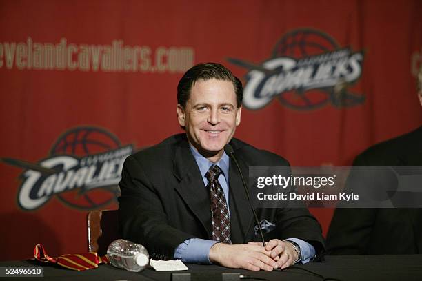 Dan Gilbert smiles during a press conference to announce the NBA has approved the purchase of the Cleveland Cavaliers by an investor group led by...