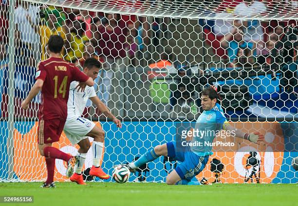 June:Iker Casillas and Eduardo Vargas in the match between Spain and Chile in the group stage of the 2014 World Cup, for the group B match at the...