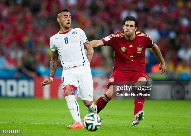 June: Arturo Vidal and Javi Martinez in the match between Spain and Chile in the group stage of the 2014 World Cup, for the group B match at the...