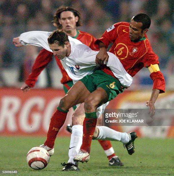 francesco-costa-of-portugal-fights-for-a-ball-with-lubos-reiter-of-slovakia-during-the-group-3.jpg