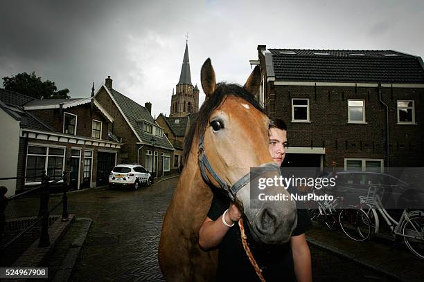 Horse dealers and their sticks used to keep the animals in place and calm. Every year on the 28th of July a horse market is held. The market...