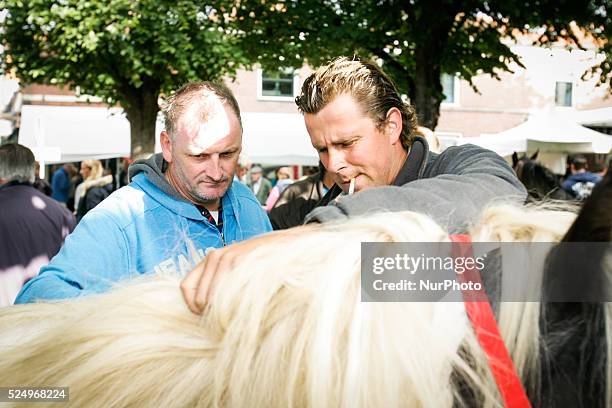 Horse dealers and their sticks used to keep the animals in place and calm. Every year on the 28th of July a horse market is held. The market...