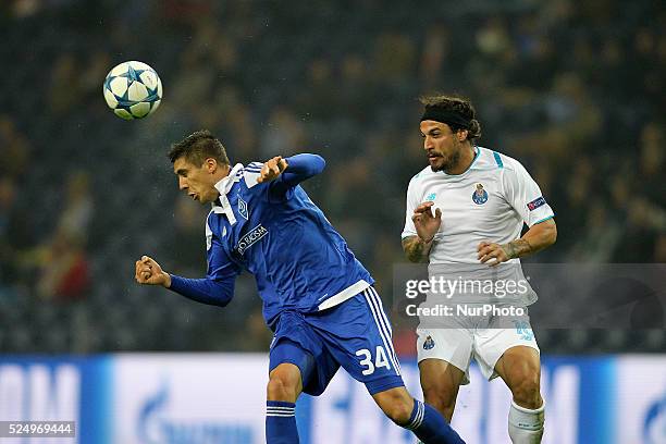 Dynamo Kiev's defender Yevhen Khacheridi in action with Porto's Itaian forward Pablo Osvaldo during the UEFA Champions League match between FC Porto...