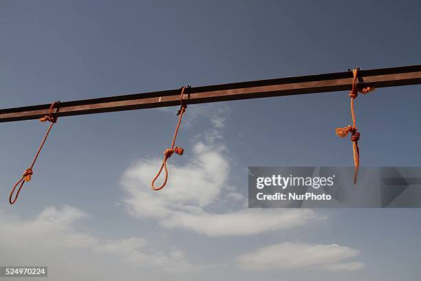 Nooses is prepared for men sentenced to death at a jail in Kabul, Afghanistan, Wednesday, Oct. 8, 2014. Afghan police take positions by nooses...
