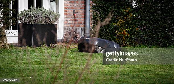 An automated lawn mowing machine or robot is seen mowing a lawn. Several weeks ago Robert Reich, the former Labor Secretary under Bill Clinton wrote...