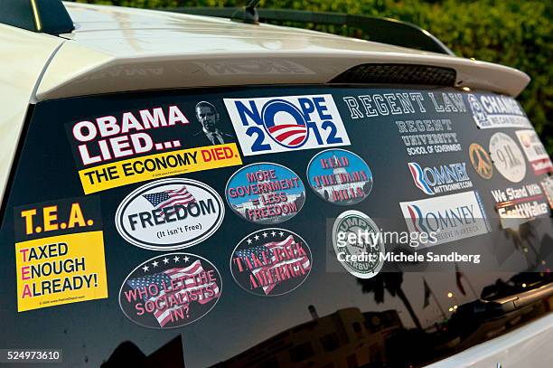 July 26, 2012 Car Bumper Stickers with Tea Party, President Obama and Mitt Romney on the back window of the car. Former NYC Mayor Rudy Giuliani and...