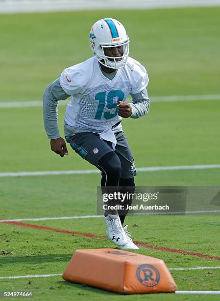 Tyler Murphy of the Miami Dolphins runs a drill during the team's voluntary veterans minicamp on April 27, 2016 at the Miami Dolphins training...