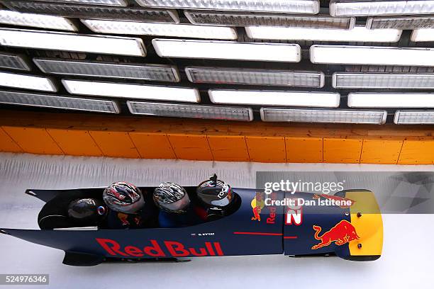 Daniil Kvyat of Russia and Red Bull Racing's personal trainer Pyry Salmela and Simon Lazenby of Sky Sports ride in a bobsleigh during previews to the...