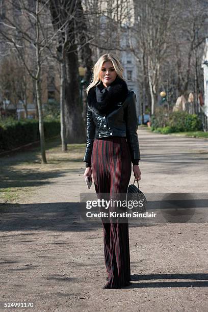 Fashion Blogger Lala Rudge wears Courreges jacket, Balmain trousers and Chanel bag on day 7 during Paris Fashion Week Autumn/Winter 2016/17 on March...