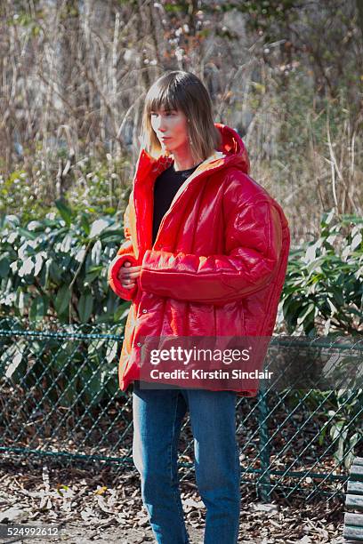 Fashion Stylist and creative consultant at Allure Russia Anya Ziourova wears a red AWAKE jacket and denim jeans on day 7 during Paris Fashion Week...