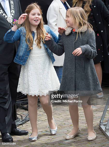 Princess Ariane and Princess Alexia of The Netherlands leave the stage after celebrations marking the 49th birthday of their father King...