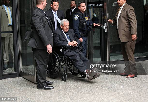 Former House Speaker Dennis Hastert leaves the Dirksen Federal Court House in a wheelchair after his sentencing on April 27, 2016 in Chicago,...