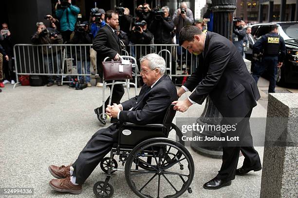 Former House Speaker Dennis Hastert leaves the Dirksen Federal Court House in a wheelchair after his sentencing on April 27, 2016 in Chicago,...