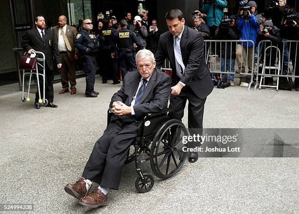 Former House Speaker Dennis Hastert leaves the Dirksen Federal Court House in a wheelchair after his sentencing on April 27, 2016 in Chicago,...