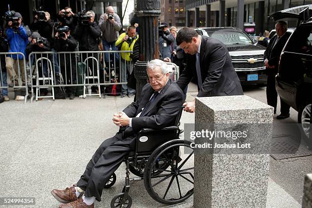 Former House Speaker Dennis Hastert leaves the Dirksen Federal Court House in a wheelchair after his sentencing on April 27, 2016 in Chicago,...