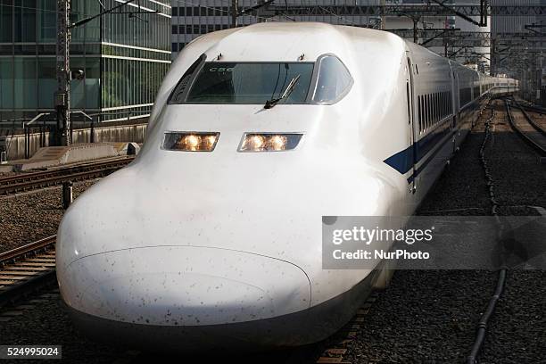 Tokai's Tokaido Shinkansen bullet trains stand at platforms at Tokyo station in Tokyo, Japan, 18 May 2015.